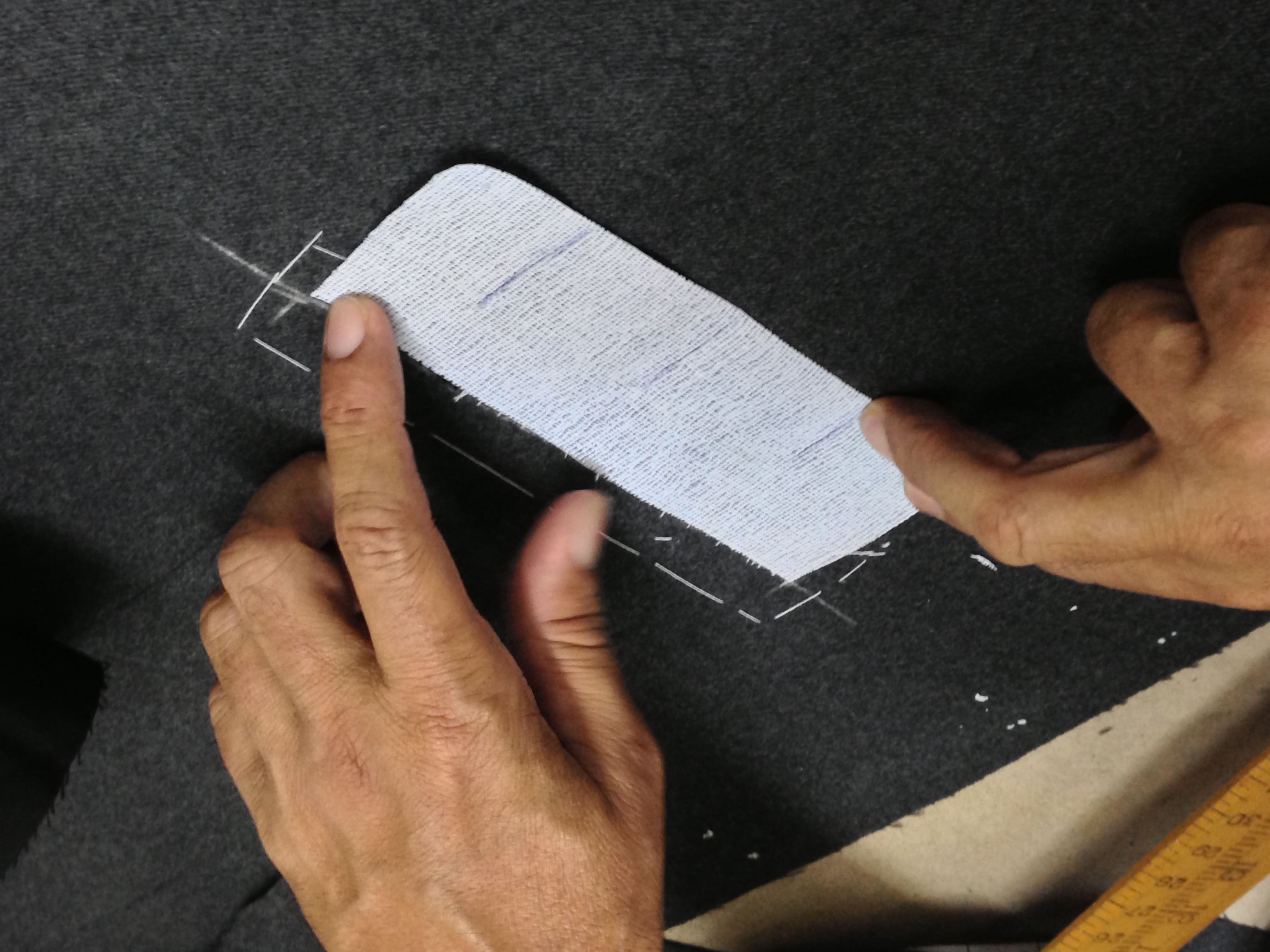 Canvas interfacing being placed on suiting cloth — construction detail